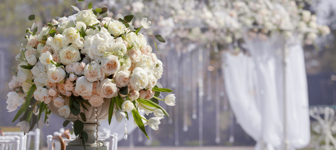 wedding bouquet with arch in background