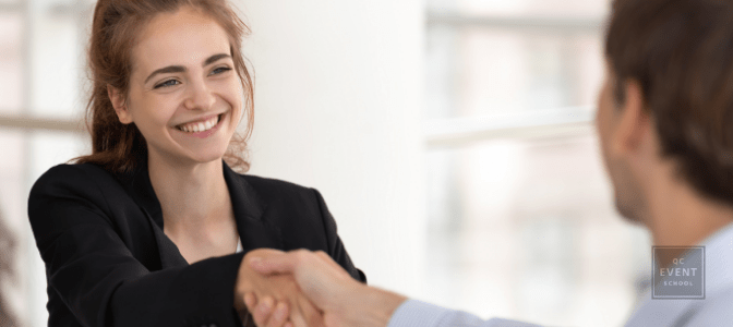 corporate event planner shaking client's hand
